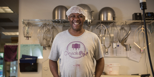 Photo of Chrysalis Pops participant, Cornell at the FEED Kitchen during a Chrysalis Pops shift.